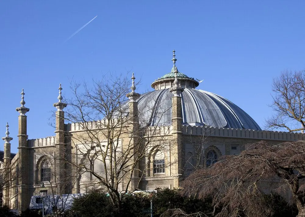 The Brighton Dome's pale dome and minarets against a clear blue sky